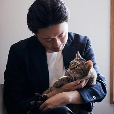 gentleman holding cat